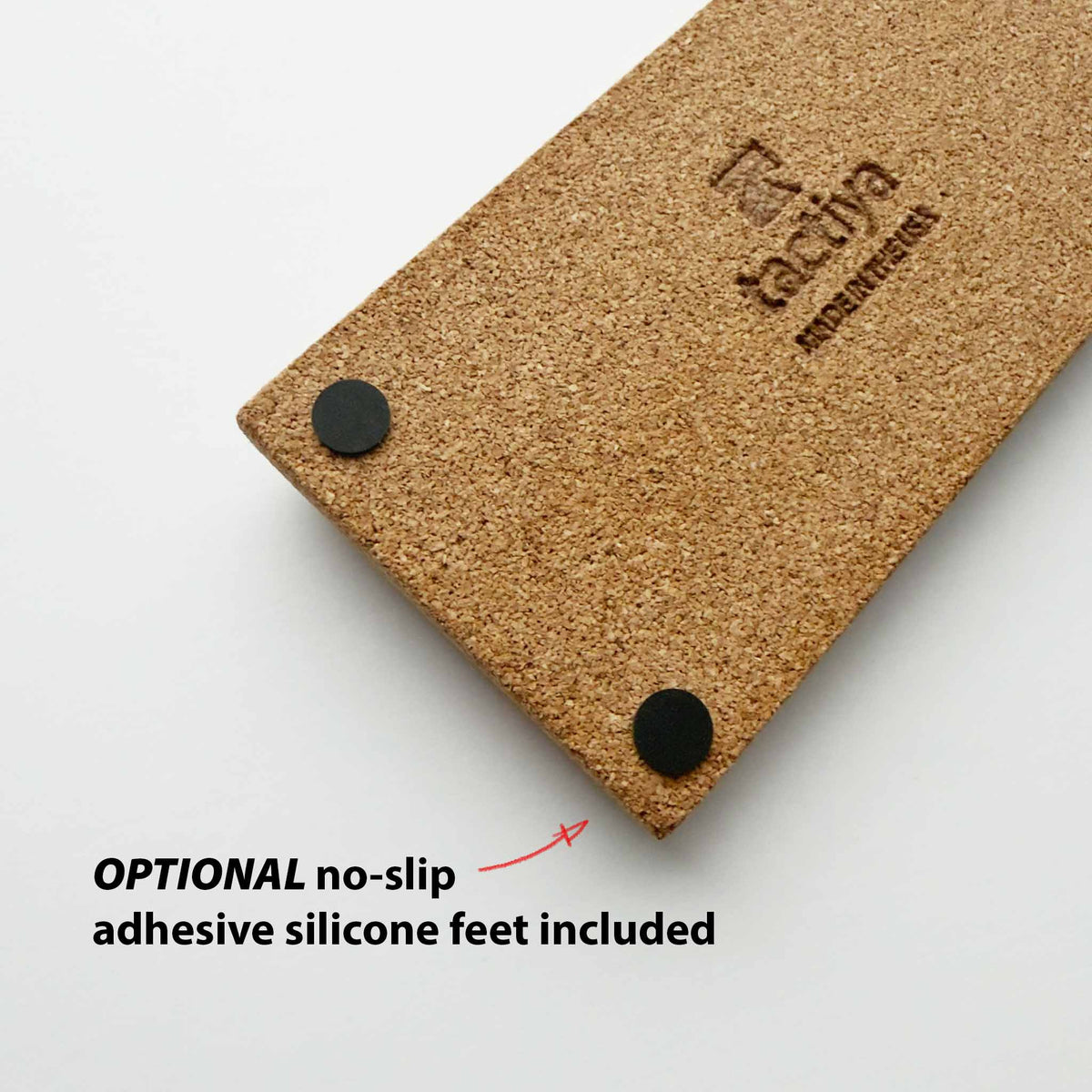 Close-up bottom of a cork wrist rest OPTIONAL no-slip adhesive silicone feet included tactiya logo